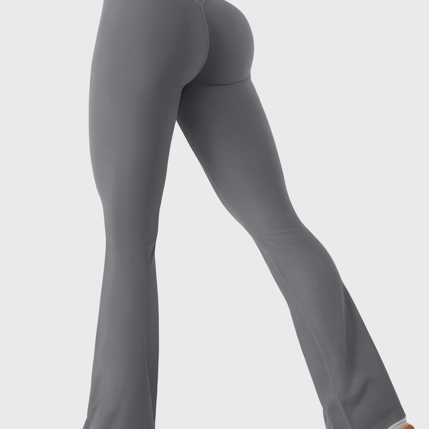 Lara Smoke bootcut mini flare leggings with V-back hidden scrunch, walking side-back pose