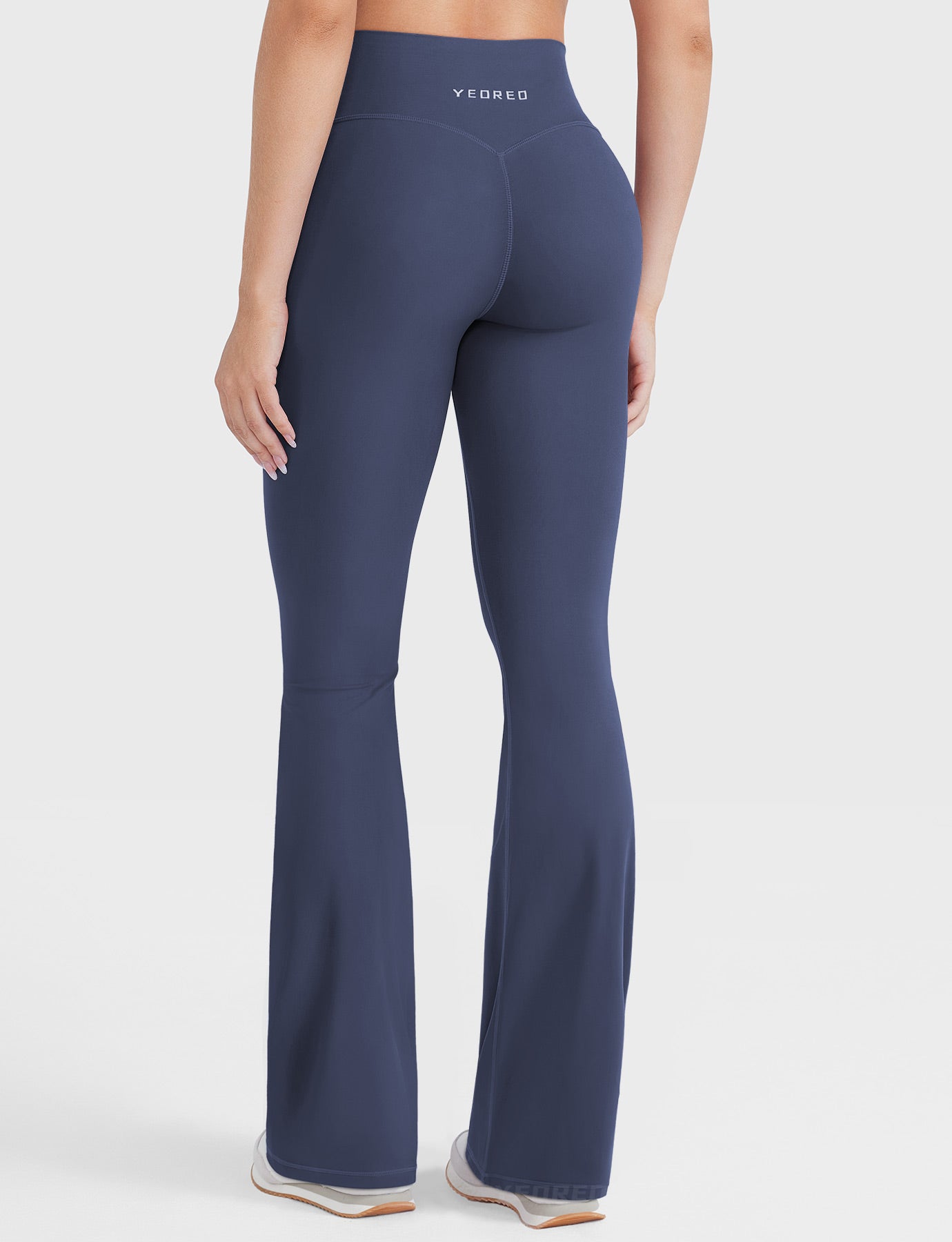 Navy hidden-scrunch bootcut leggings, clean back view