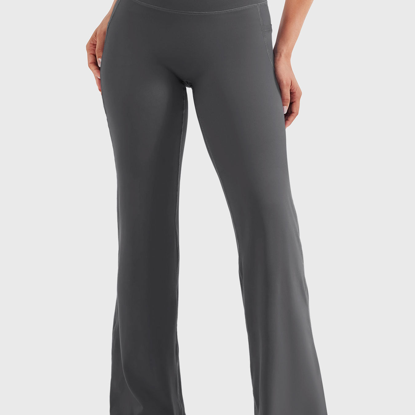 Front view—model wearing dark grey high waisted straight leg leggings with no front seam