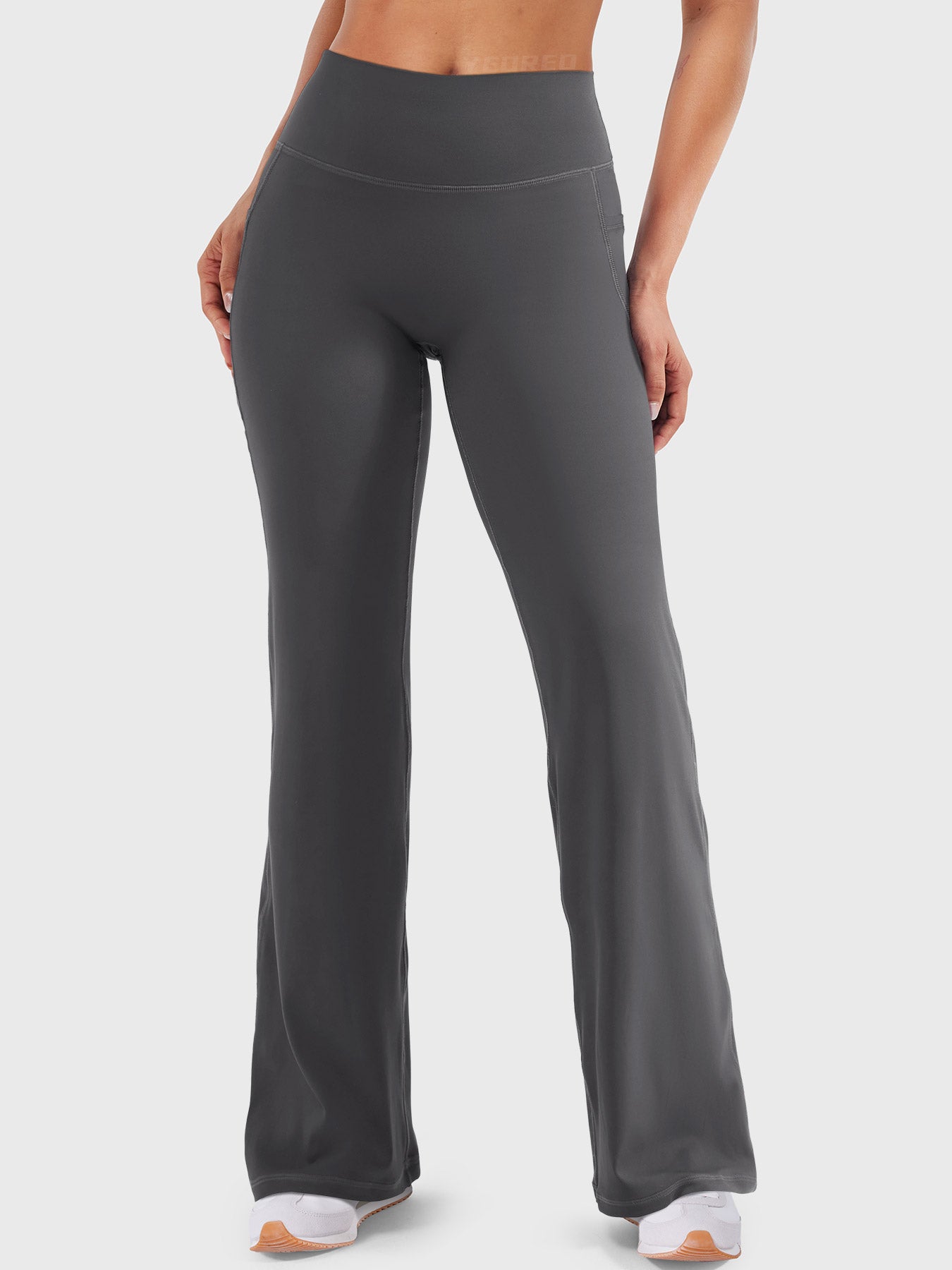 Dark grey high waisted straight leg leggings with pockets, no front seam fit, smooth and flattering front view