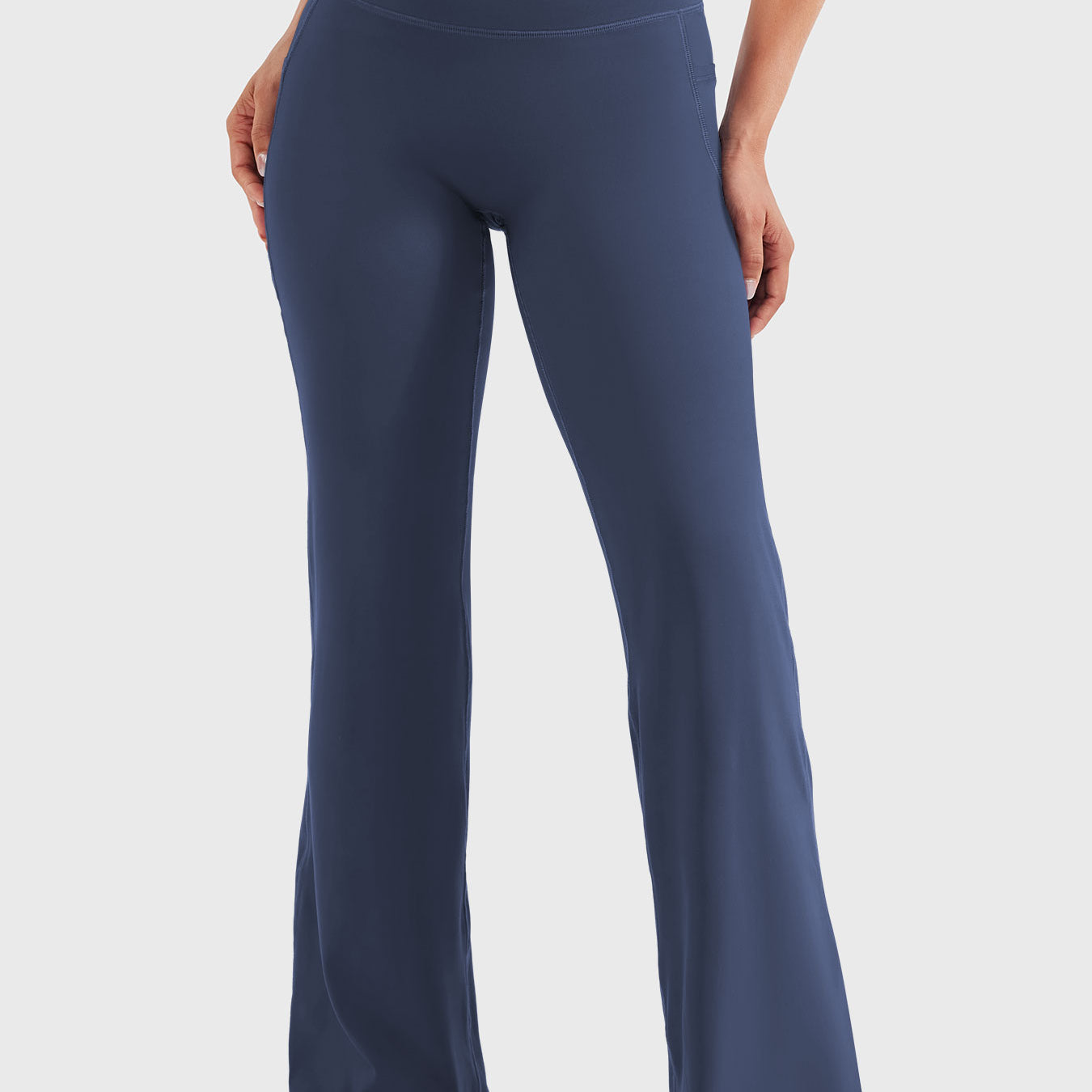 Front view—model wearing navy high waisted straight leg leggings with no front seam, 29-inch inseam