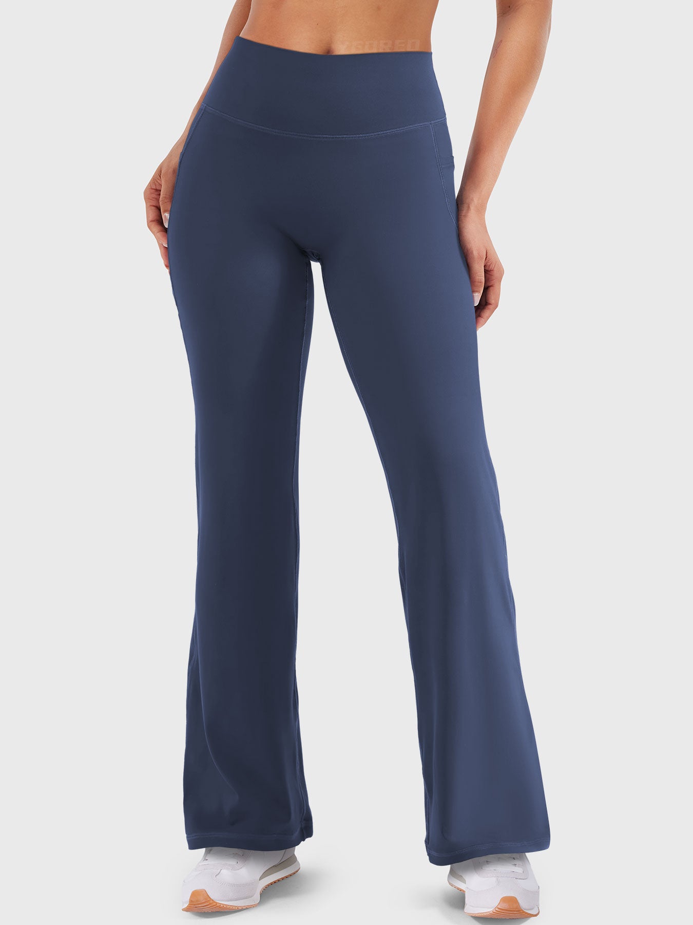 Front view—model wearing navy high waisted straight leg leggings with no front seam, 29-inch inseam