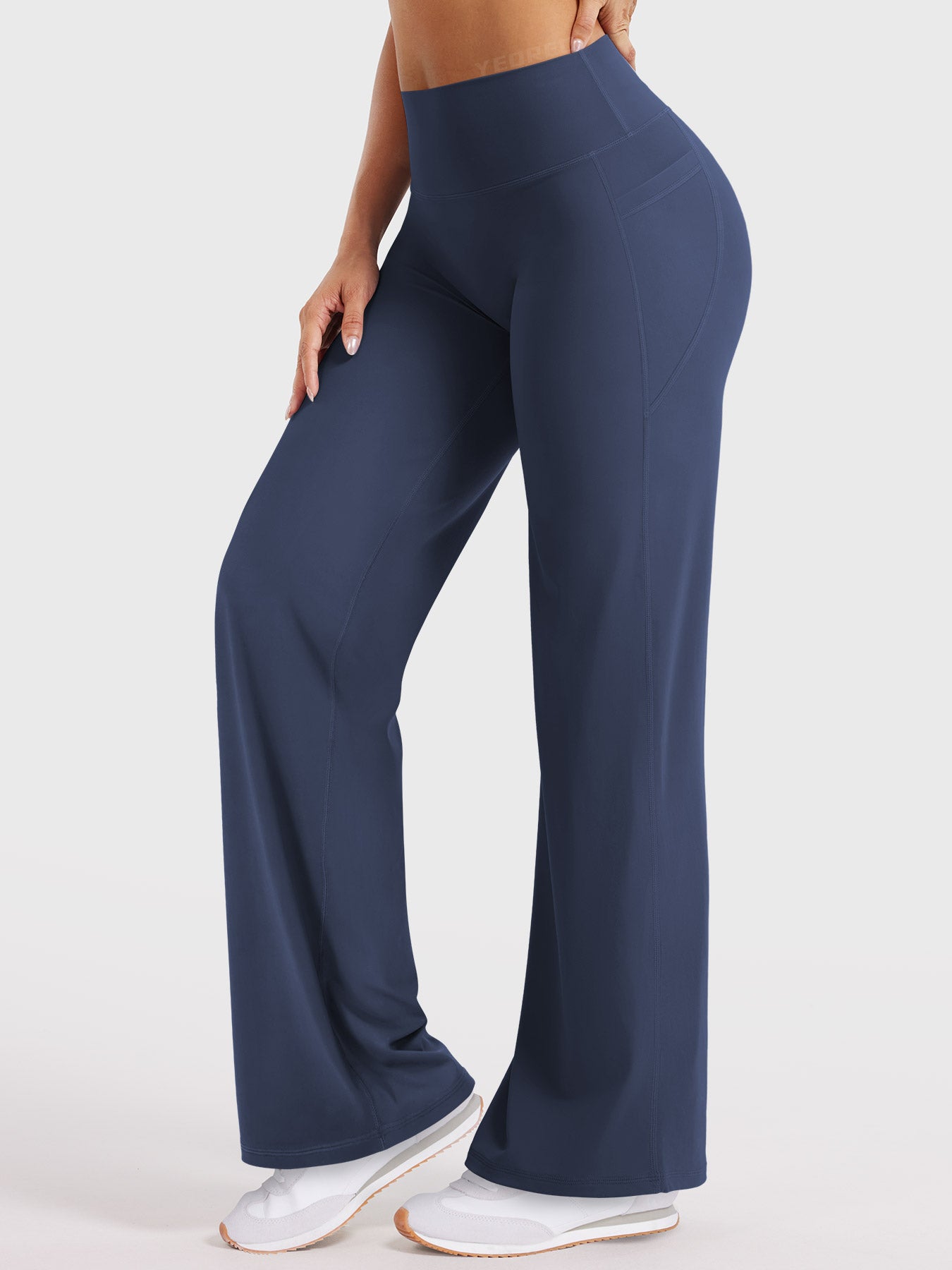 Navy straight leg workout leggings in forward stance, buttery soft flexibility