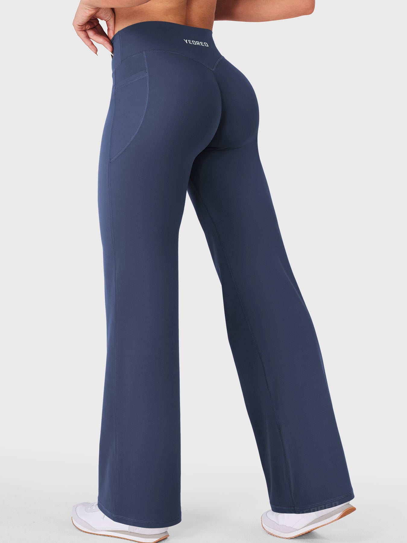 Navy athleisure straight leg leggings in walking motion, comfortable all day wear