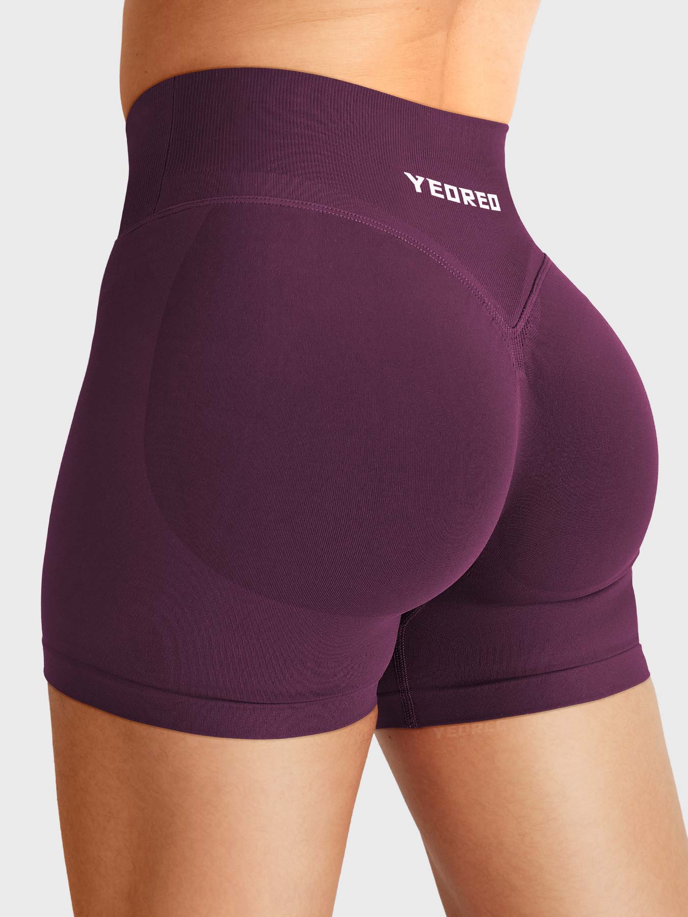 Black Cherry Baderiy 4.5" V-waistband seamless shorts angled back view, subtle glute contour for natural butt lift
