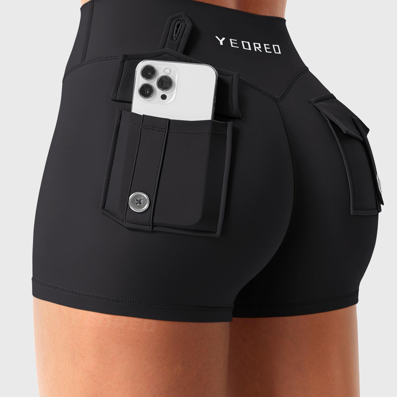 Black Yeoreo Darilya CoreFlex low rise cargo shorts angled back view, dual cargo pockets providing functional storage