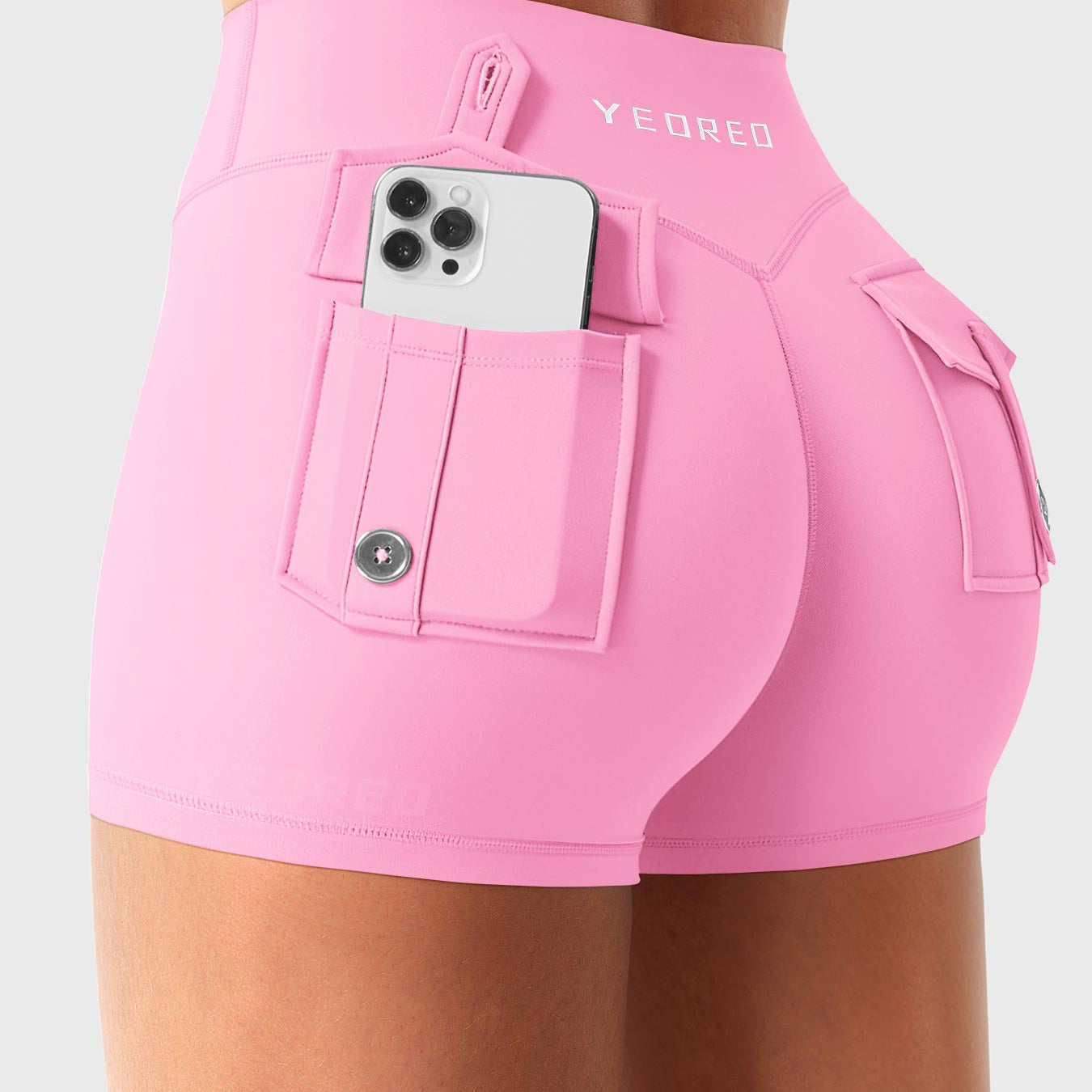 Bubblegum Pink Yeoreo Darilya CoreFlex low rise cargo shorts angled back view, rear cargo pockets for convenient storage