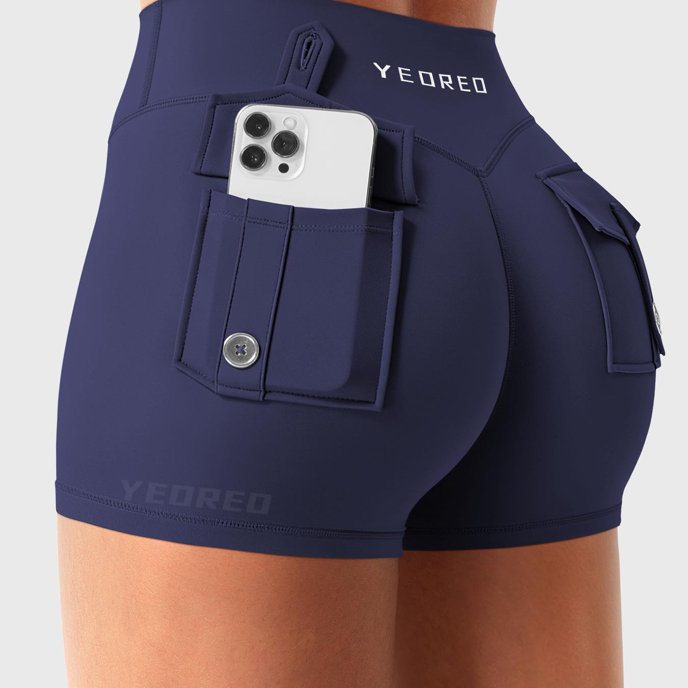 Navy Yeoreo Darilya CoreFlex low rise cargo shorts angled back view, dual cargo pockets with functional utility design