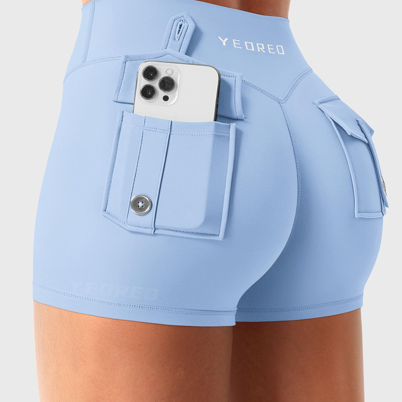 Light Blue Yeoreo Darilya CoreFlex low rise cargo shorts angled back view, dual rear cargo pockets with functional storage