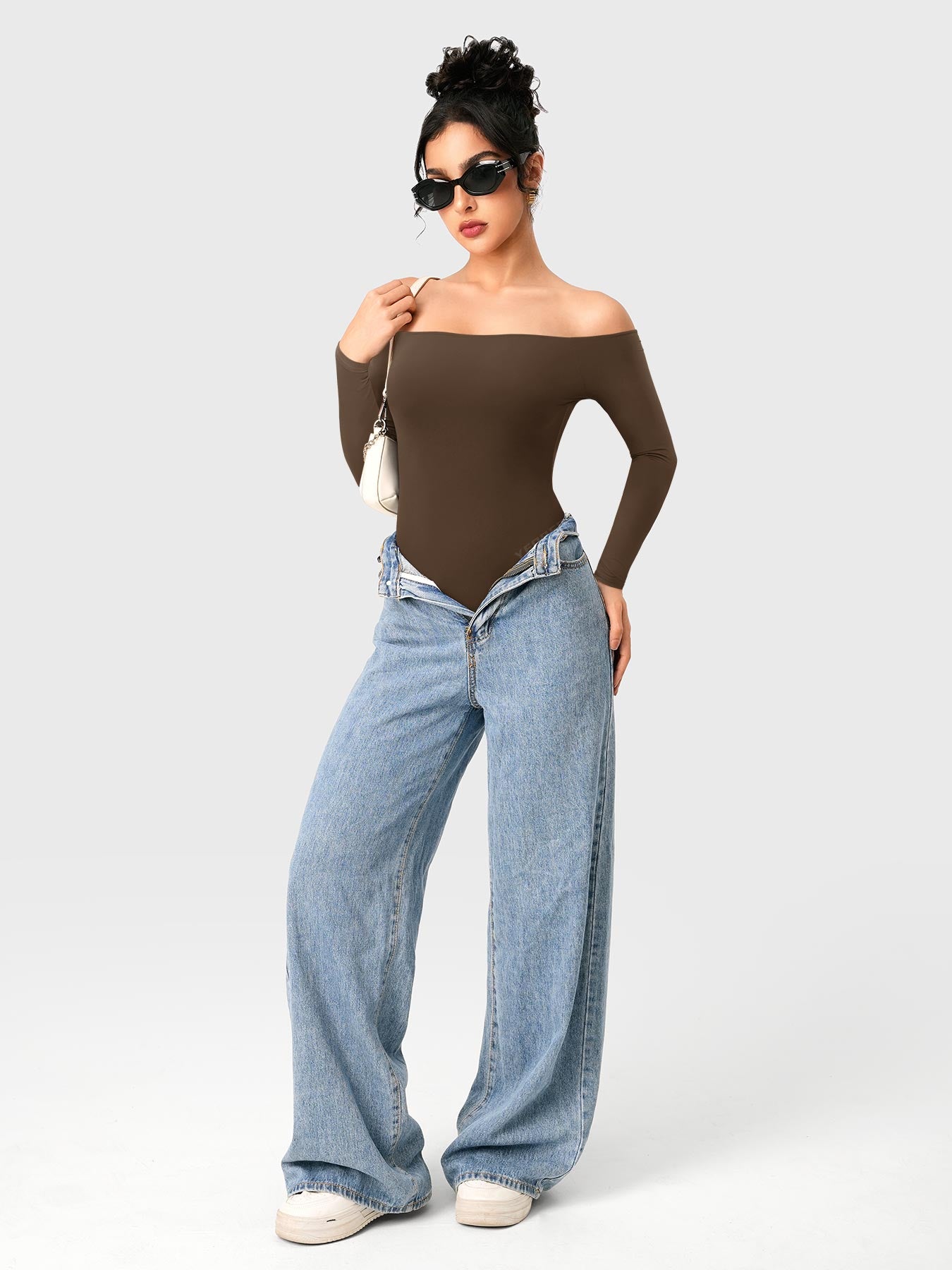 Dacrly Off Shoulder Bodysuit in deep brown, full body front view layered with jeans, styled with sunglasses and mini bag, Y2K street style