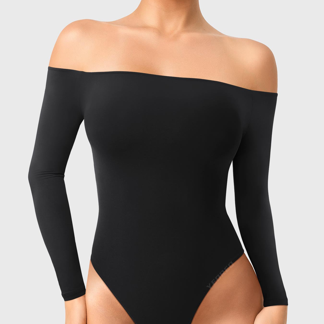 Dacrly Off Shoulder Bodysuit in black, front view standing, off shoulder neckline, sleek and body-hugging fit