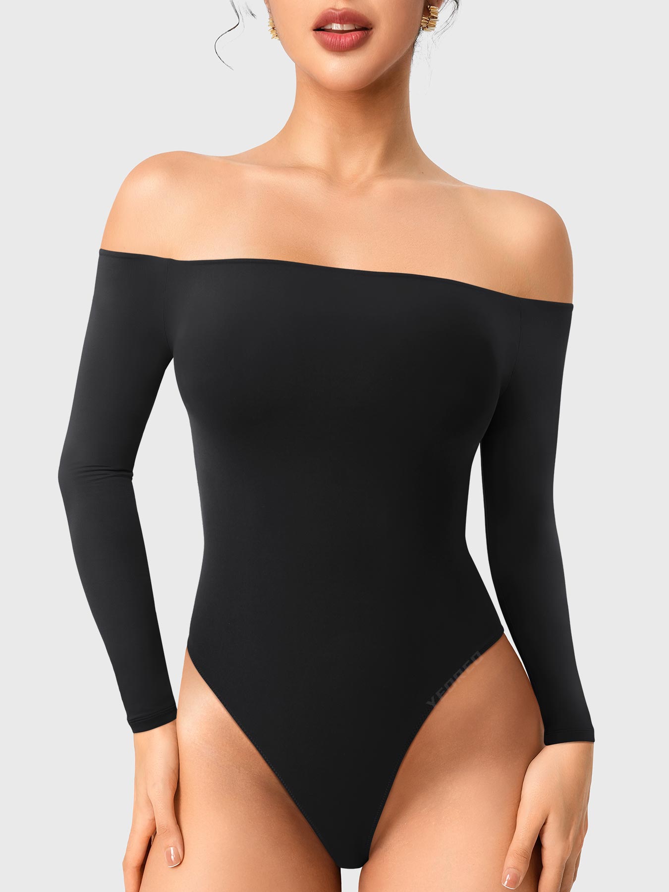 Dacrly Off Shoulder Bodysuit in black, front view standing, off shoulder neckline, sleek and body-hugging fit