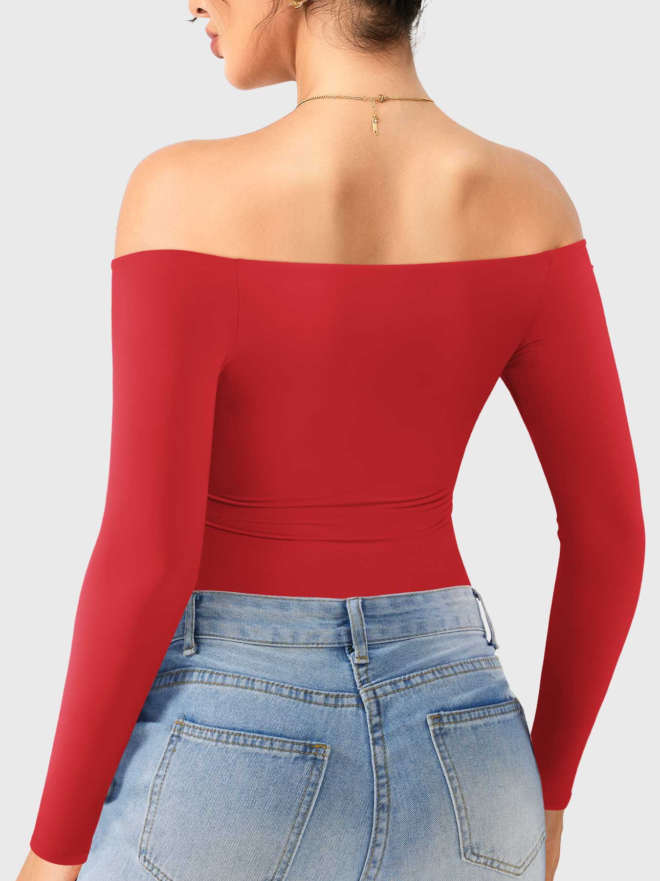 Dacrly Off Shoulder Bodysuit in red, back view layered with jeans, fitted silhouette, casual street style wear