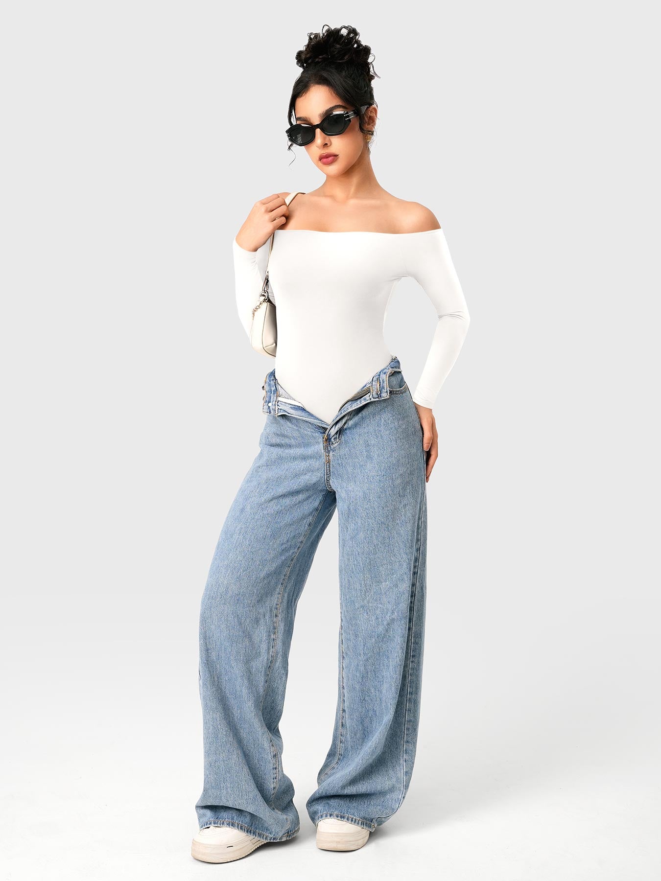 Dacrly Off Shoulder Bodysuit in white, full body front view layered with jeans, styled with sunglasses and shoulder bag, Y2K outfit