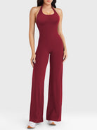 Front view—model wearing anchor red halter open-back straight-leg jumpsuit