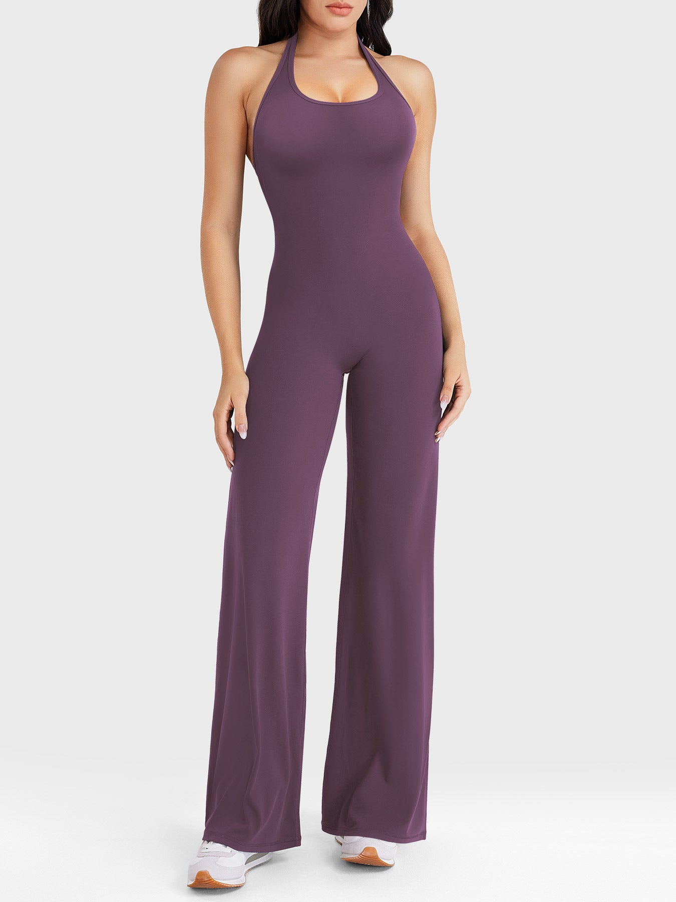 Front view—model wearing black berry halter open-back straight-leg jumpsuit