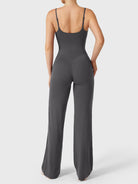 Dagyane Straight Leg Jumpsuit in dark grey, back pose, open back, adjustable shoulder straps, V-back glute shaping