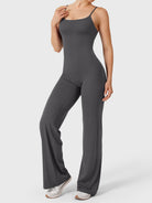 Dagyane Straight Leg Jumpsuit in dark grey, angled front pose, smooth abdomen, flowing body lines, straight leg silhouette