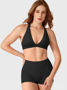 Black Yeoreo Wafiya V-neck sports bra front view styled with matching shorts, sleek supportive fit