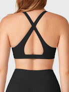 Black Yeoreo Wafiya sports bra back view, cross back strap design with open cutout detail