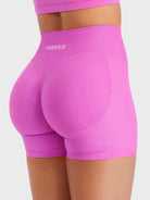 Flower Powder Baderiy 4.5" seamless shorts angled rear view, smooth compression for a flattering silhouette