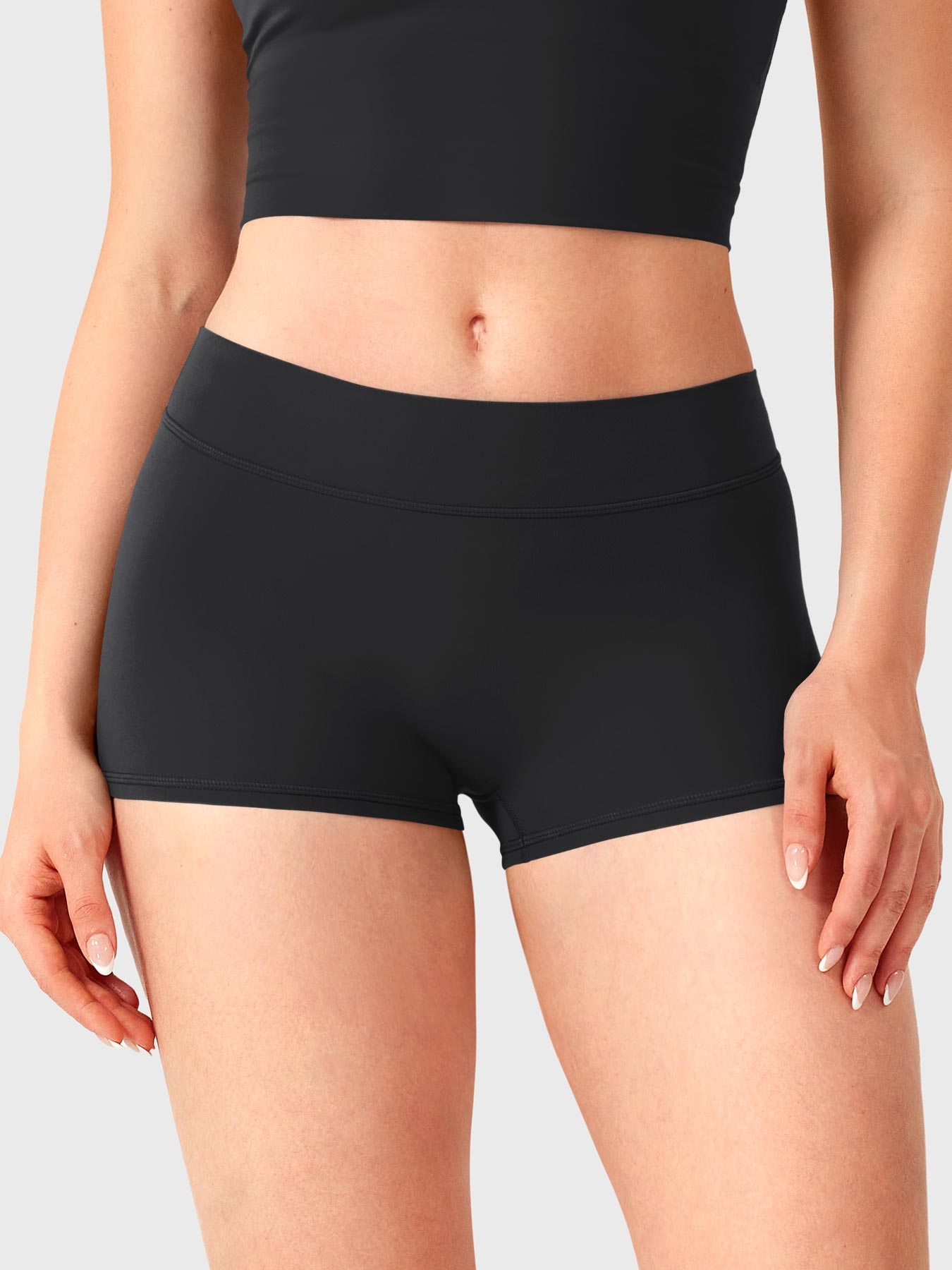 Black Yeoreo Zahida 2.5 inch inseam shorts front view, ultra low rise fit creating sleek waistline