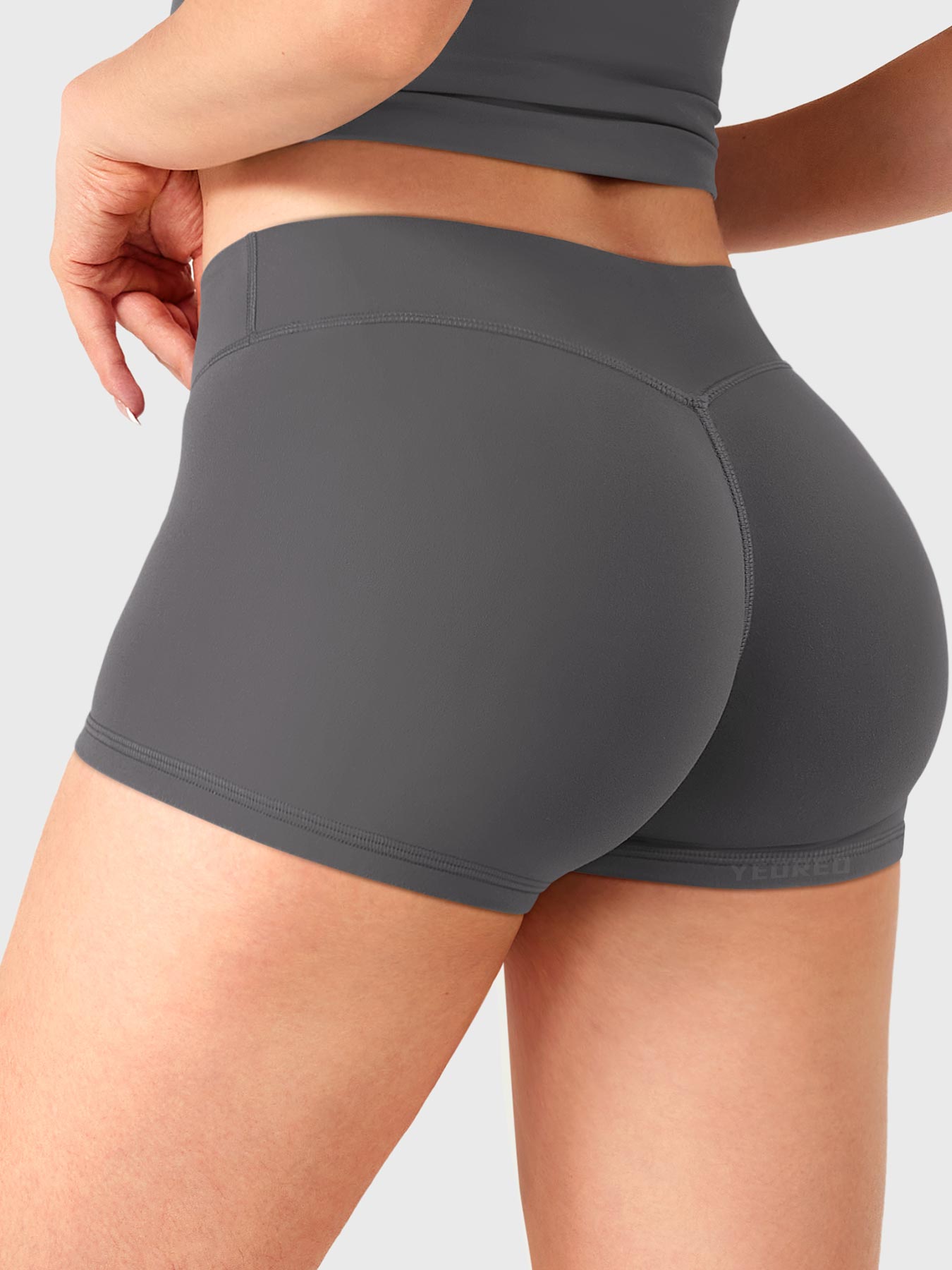 Dark Grey Yeoreo Zahida 2.5 inch low rise shorts angled back view, subtle V-back contour enhancing glutes