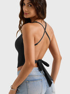 Black Yeoreo Kagina backless tank angled rear view, adjustable shoulder straps and waist tie detail