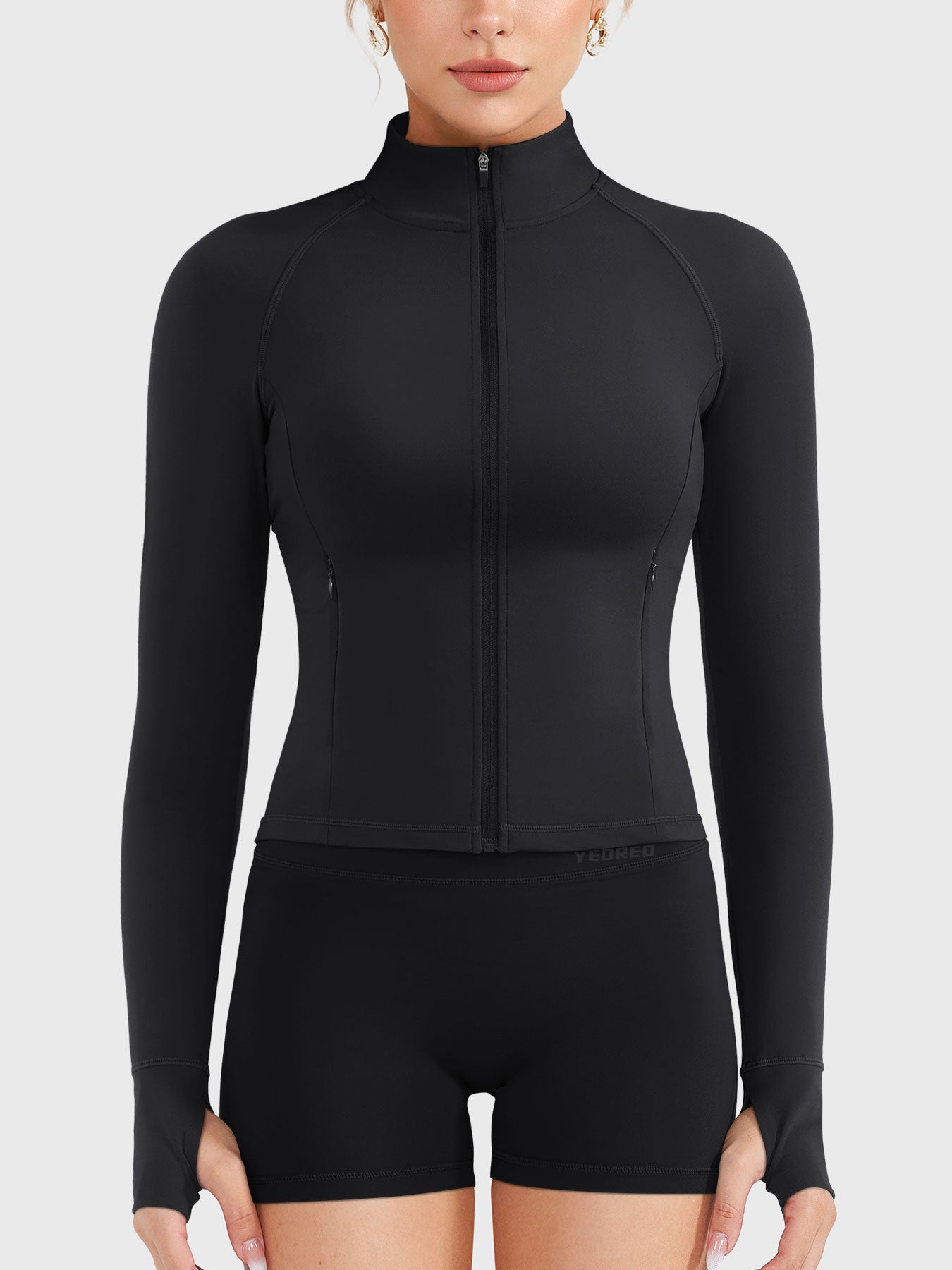 Candecy Full Zip Workout Jacket in black, front view fully zipped, high neck design, streamlined and supportive fit