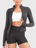 Candecy Full Zip Workout Jacket in deep grey, front view with zipper open, relaxed layering look for workouts or everyday wear