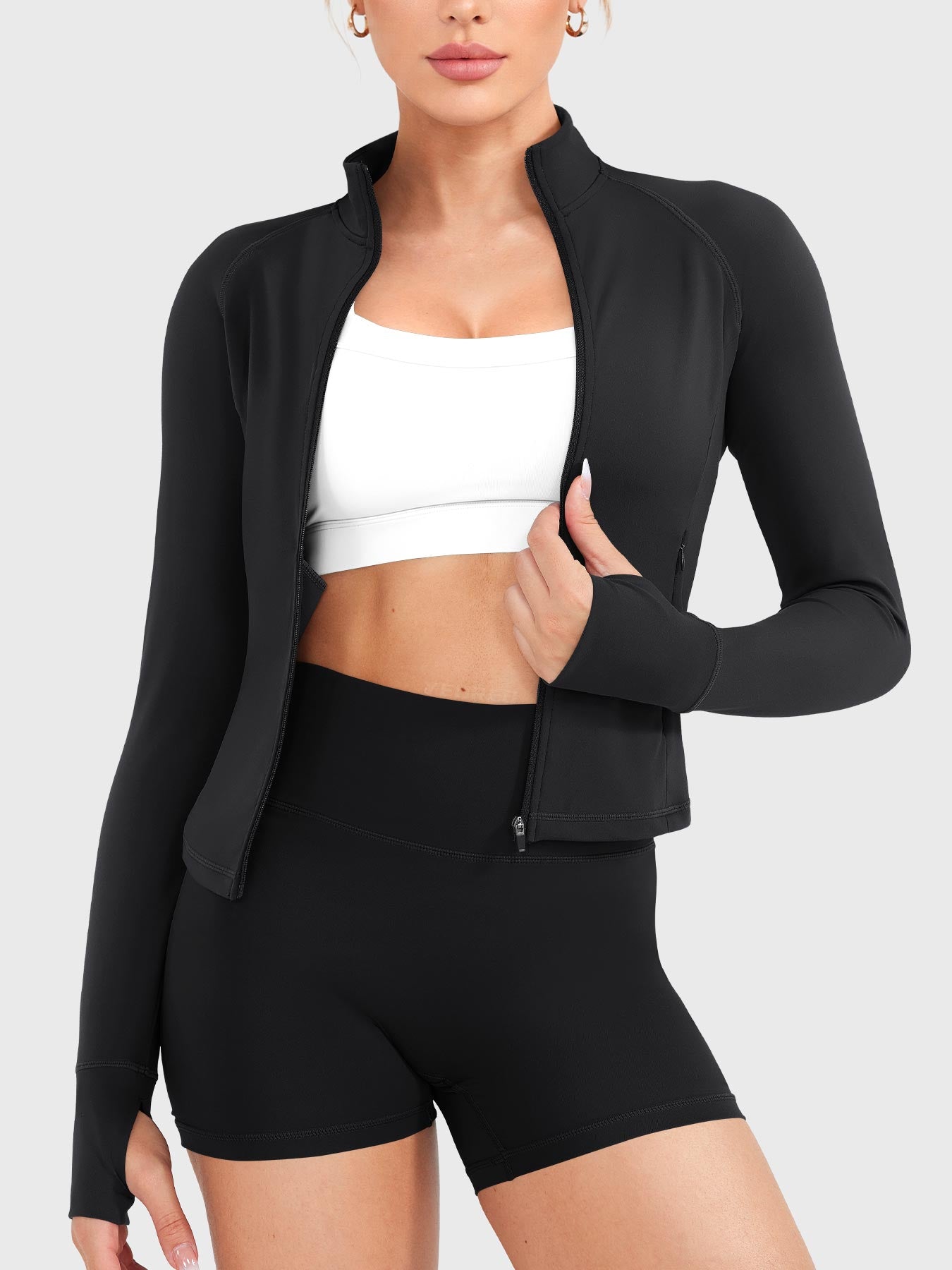 Candecy Full Zip Workout Jacket in black, front view worn open, versatile layering style for training or casual wear