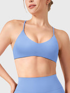Ice Blue Yeoreo Zaahira V-neck sports bra front view, clean neckline shaping collarbone and shoulders
