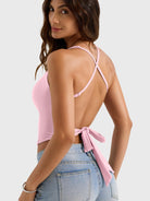 Light Pink Yeoreo Kagina backless tank angled rear view, adjustable spaghetti straps and tie-back detail