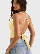 Milk Yellow Yeoreo Kagina backless tank angled back view, adjustable straps and tie-back waist accent