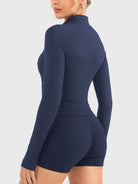 Candecy Full Zip Workout Jacket in navy, angled back view, minimal back design, body-contouring silhouette