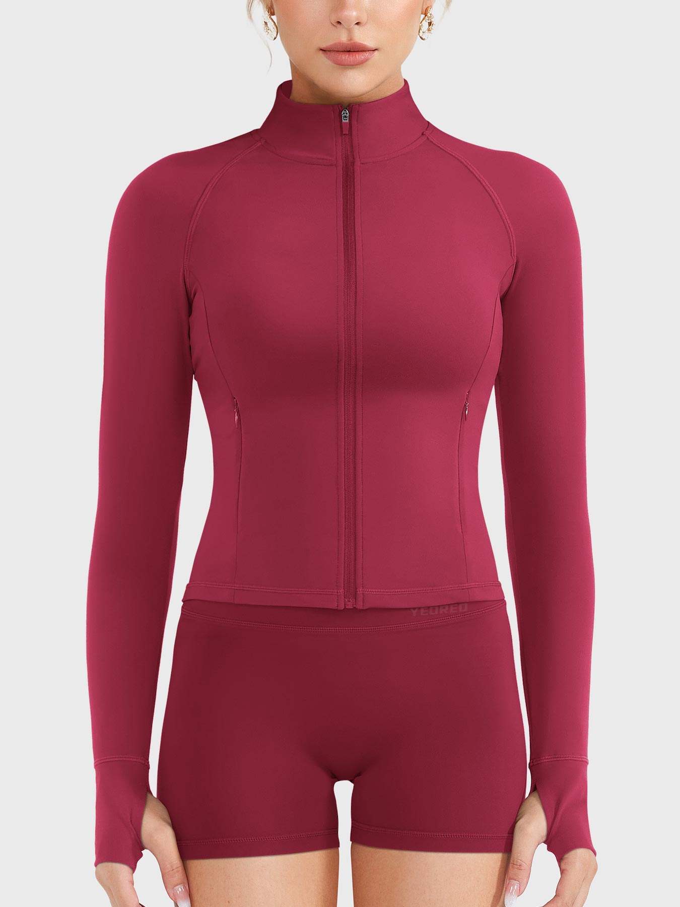 Candecy Full Zip Workout Jacket in ruby red, front view fully zipped, high neck design, sleek and supportive activewear fit