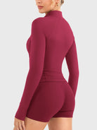 Candecy Full Zip Workout Jacket in ruby red, angled back view, clean back silhouette, slim and flattering cut