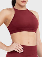 Acuffny High Neck Backless Sports Bra in scarlett red, angled front upper body view, sculpted bust shape, smooth and supportive fit