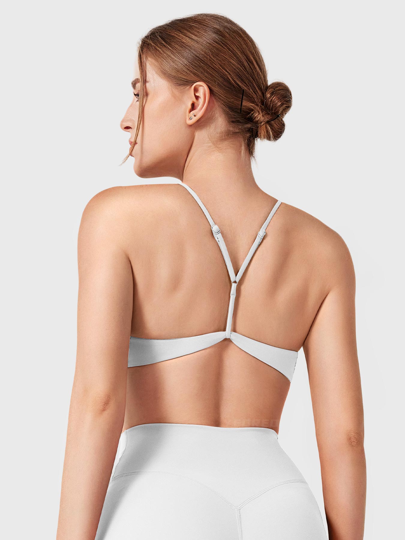White Yeoreo Zaahira adjustable sports bra back view, adjustable Y-back strap design highlighting back contour