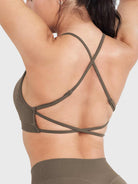 Acuffny High Neck Backless Sports Bra in coffee, angled back view with arms raised, open back design, adjustable crisscross straps, secure side coverage