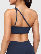 Claranie One Shoulder Sports Bra in navy, angled back view upper body, open back with adjustable strap, clean and breathable design