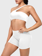 Claranie One Shoulder Sports Bra in white, angled front upper body view styled with shorts, smooth body-hugging fit