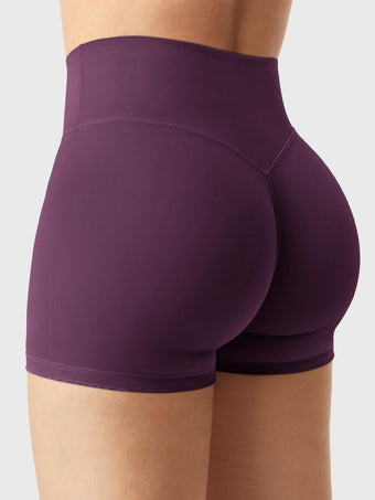 Side-back view of Yeoreo Elysina 2.5" Running Shorts in Black Cherry with model in different pose showing glute contour