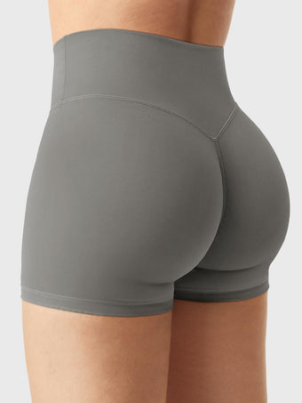 Side-back view of Yeoreo Elysina 2.5" Running Shorts in Dark Grey with model in different pose showing glute contour