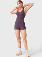 Black Berry Yeoreo Daiane halter neck romper full length view, athletic fitted one piece shorts for flattering silhouette