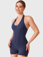 Dark Blue Yeoreo Daiane halter romper angled front view, seamless no front seam design with smooth sculpted silhouette