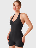 Black Yeoreo Daiane halter romper angled front view, seamless no front seam detail for clean silhouette