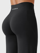 Back-angle close-up highlighting V-back detail and flattering booty shape in black leggings