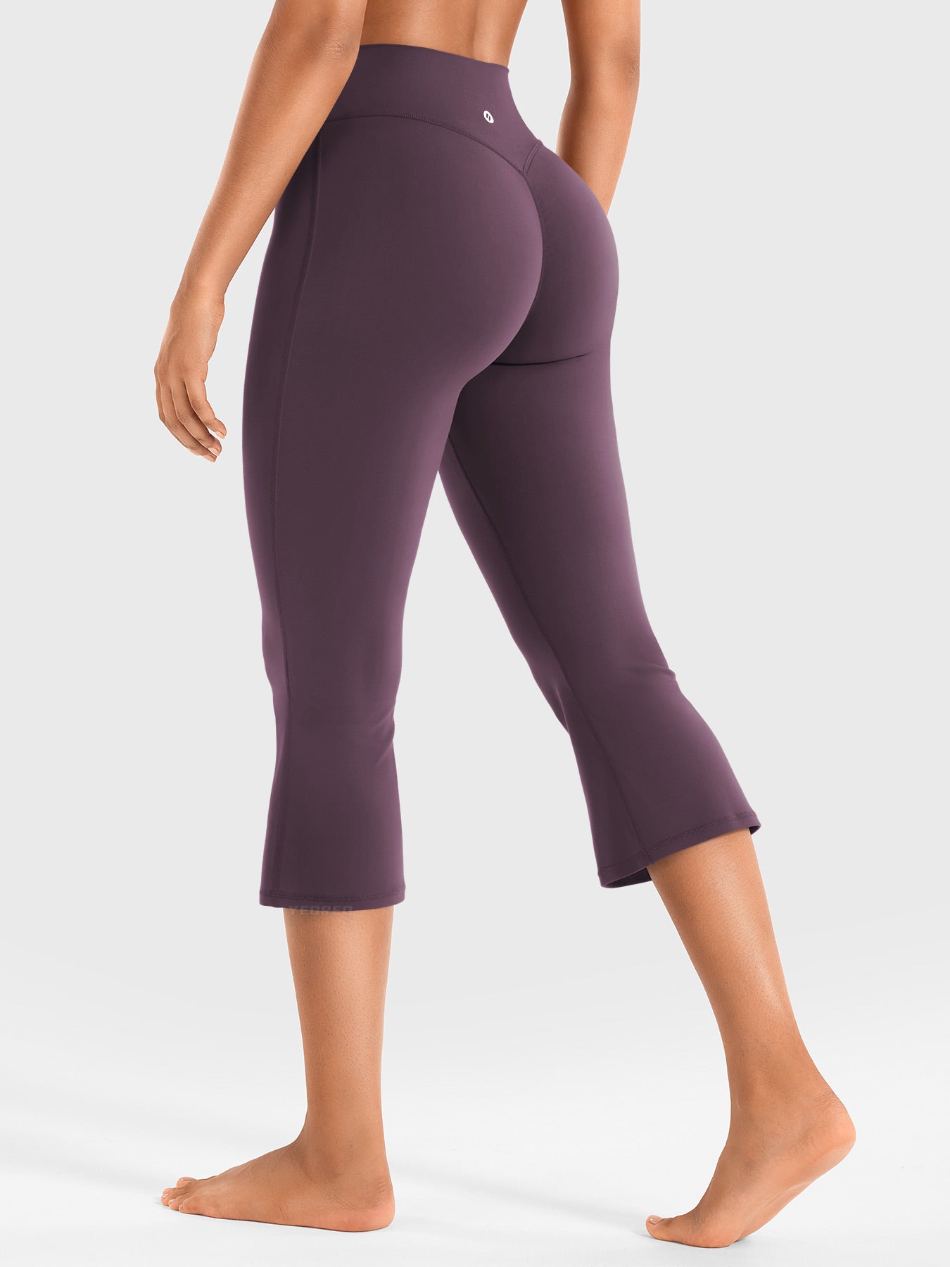 Black berry Yeoreo Daiane flare capri leggings full back view, V-back shaping detail with stretchy fabric silhouette