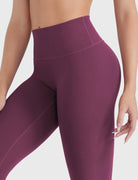 Close-up of Deep Cherry Red high-rise leggings, no-front-seam waist detail